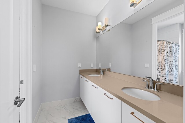 10715 Estuary Dr, Parkland, FL 33076 - full bathroom with a sink, baseboards, double vanity, and marble finish floor