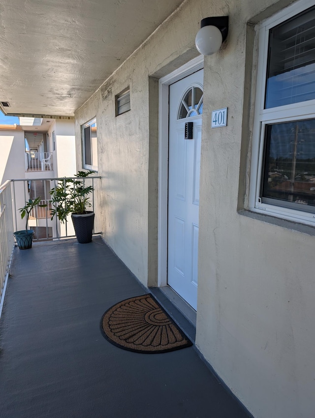 doorway to property with stucco siding
