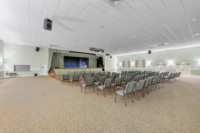cinema featuring carpet floors and visible vents