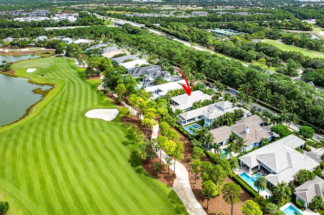 bird's eye view with a water view, a residential view, and golf course view