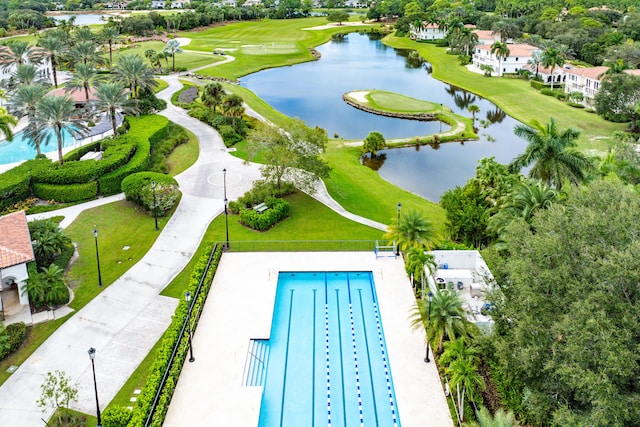 aerial view featuring view of golf course and a water view