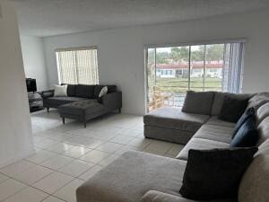 living area with light tile patterned floors