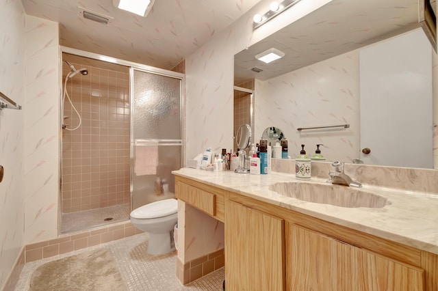 6585 Kensington Ln Unit 307, Delray Beach, FL 33446 - full bathroom featuring toilet, vanity, a stall shower, and tile patterned flooring