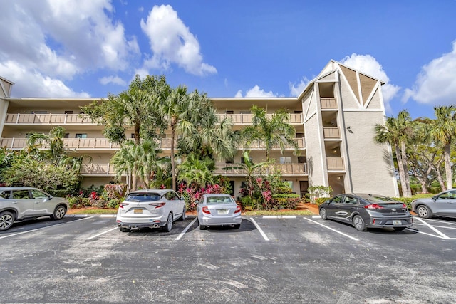 6585 Kensington Ln Unit 307, Delray Beach, FL 33446 - view of apartment building / complex featuring uncovered parking