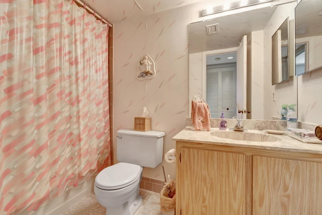 6585 Kensington Ln Unit 307, Delray Beach, FL 33446 - bathroom featuring vanity, toilet, tile patterned flooring, and shower / tub combo with curtain