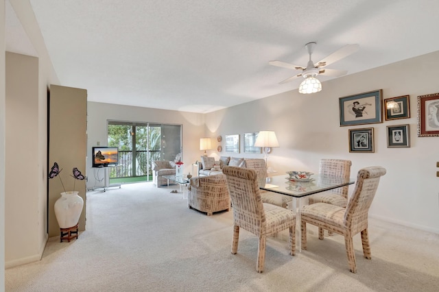 6585 Kensington Ln Unit 307, Delray Beach, FL 33446 - dining area with light carpet, a ceiling fan, and baseboards