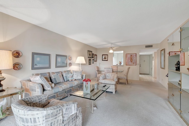 6585 Kensington Ln Unit 307, Delray Beach, FL 33446 - living room featuring light carpet and a ceiling fan