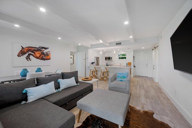 13334 Polo Club Rd Unit 234/235, Wellington, FL 33414 - living room featuring visible vents, beam ceiling, baseboards, recessed lighting, and light wood-style flooring