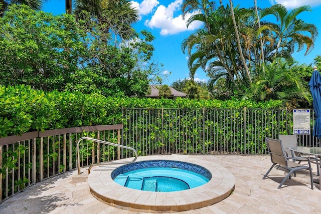 13334 Polo Club Rd Unit 234/235, Wellington, FL 33414 - view of pool with fence, a patio, and a hot tub