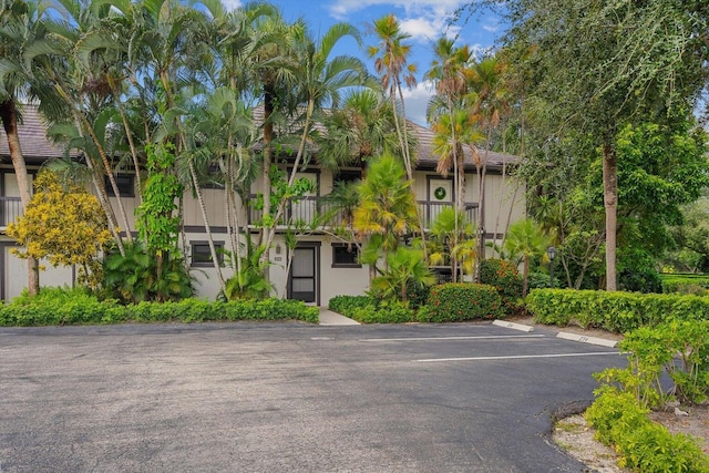 13334 Polo Club Rd Unit 234/235, Wellington, FL 33414 - view of property with uncovered parking