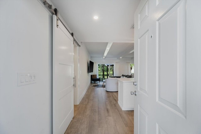 13334 Polo Club Rd Unit 234/235, Wellington, FL 33414 - corridor featuring baseboards, light wood-style flooring, recessed lighting, and a barn door
