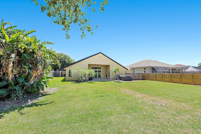500 N Cypress Dr, Tequesta, FL 33469 - back of property with stucco siding and a hot tub