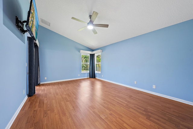 500 N Cypress Dr, Tequesta, FL 33469 - empty room featuring a ceiling fan, wood finished floors, lofted ceiling, and baseboards