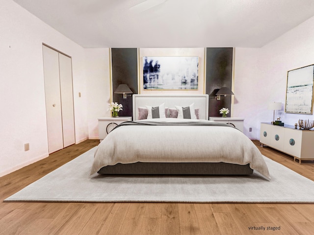 3206 Carambola Cir S, Coconut Creek, FL 33066 - bedroom with baseboards and wood finished floors