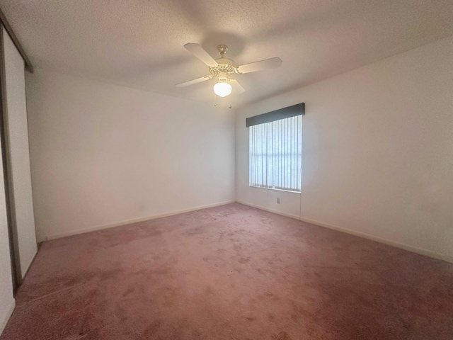 3206 Carambola Cir S, Coconut Creek, FL 33066 - unfurnished room featuring a textured ceiling, light carpet, baseboards, and ceiling fan