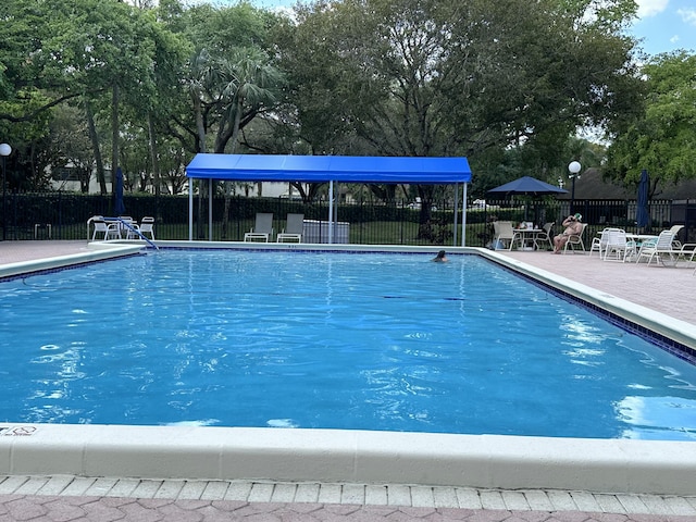 3206 Carambola Cir S, Coconut Creek, FL 33066 - community pool featuring fence and a patio area