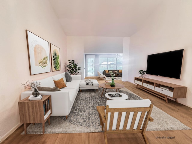 3206 Carambola Cir S, Coconut Creek, FL 33066 - living room featuring lofted ceiling and wood finished floors