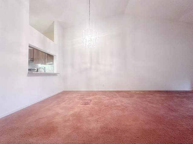3206 Carambola Cir S, Coconut Creek, FL 33066 - unfurnished room with baseboards, a chandelier, high vaulted ceiling, and carpet