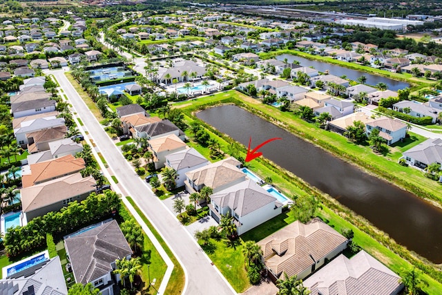 aerial perspective of suburban area with a large body of water