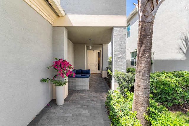 property entrance featuring stucco siding