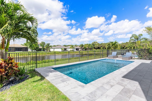 view of pool with a water view and a patio