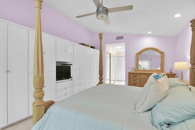 bedroom featuring ceiling fan, recessed lighting, light tile patterned floors, and multiple closets