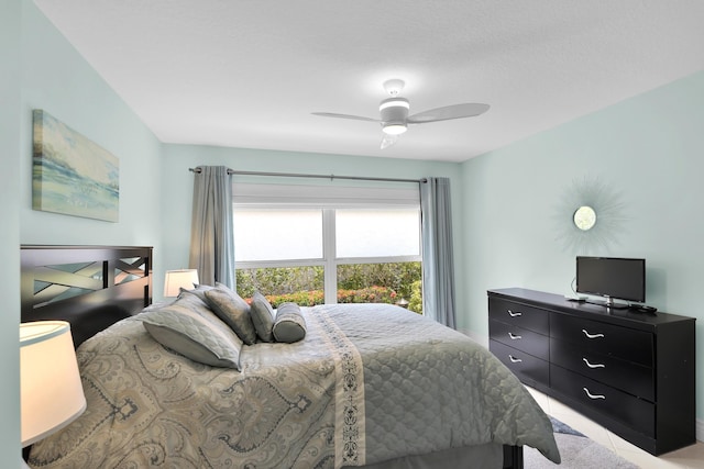bedroom featuring ceiling fan and light tile patterned floors