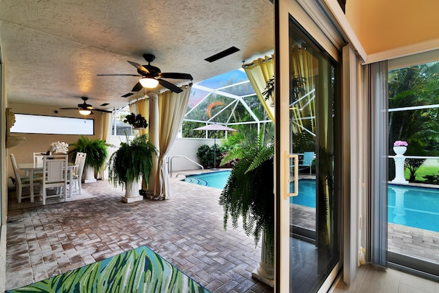 outdoor pool featuring a patio, a ceiling fan, a lanai, and outdoor dining space
