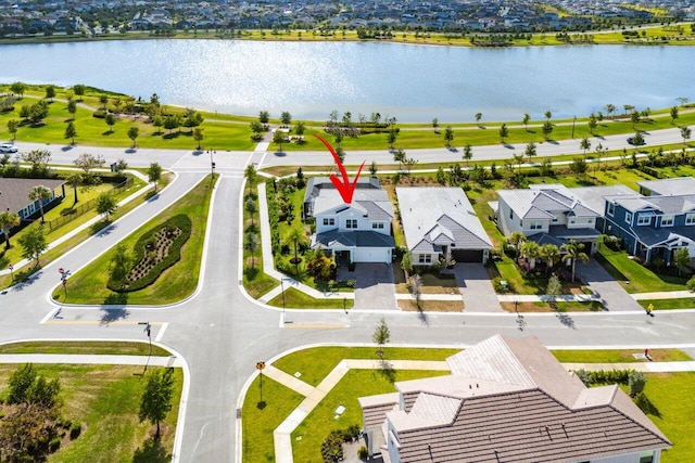 aerial view featuring a water view and a residential view