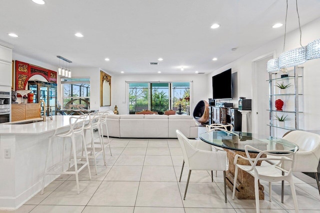dining space featuring light tile patterned floors, recessed lighting, and visible vents