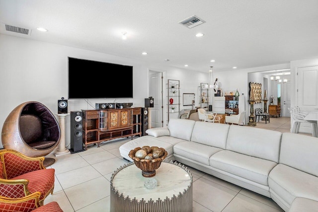 living room with a chandelier, recessed lighting, light tile patterned flooring, and visible vents
