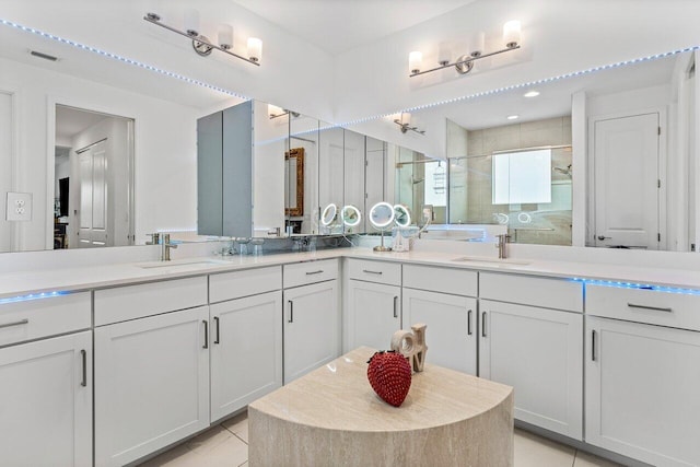bathroom with vanity, a shower stall, tile patterned floors, and visible vents