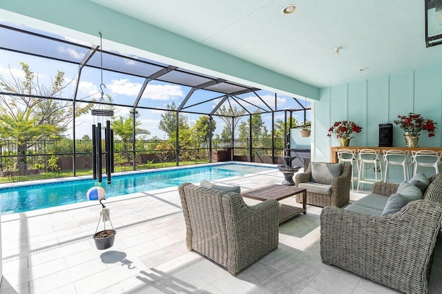 pool with a patio, a lanai, and outdoor dry bar