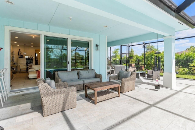 view of patio / terrace with glass enclosure and outdoor lounge area