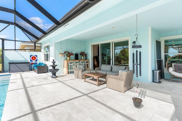 view of patio featuring glass enclosure, an outdoor living space, and a pool