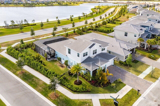 drone / aerial view featuring a water view and a residential view