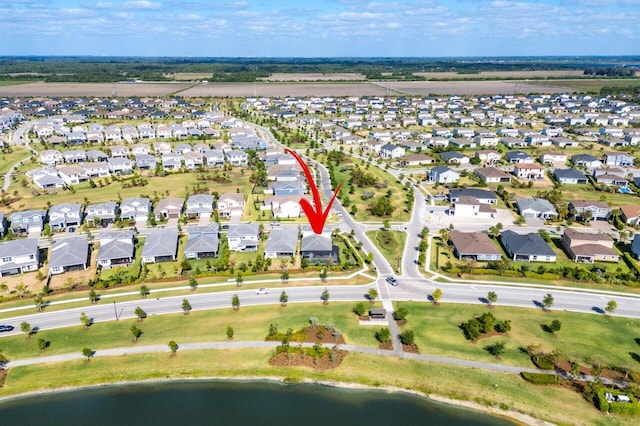 aerial view with a water view and a residential view