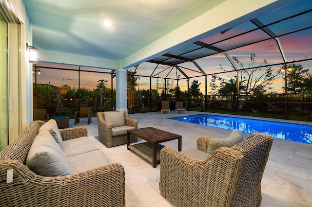 pool featuring an outdoor living space, a lanai, and a patio area
