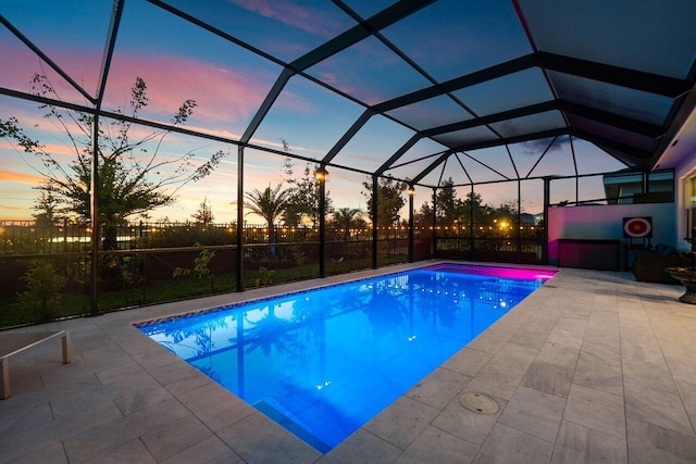 outdoor pool featuring a lanai and a patio