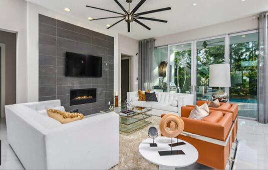 living room with recessed lighting, marble finish floor, and a fireplace