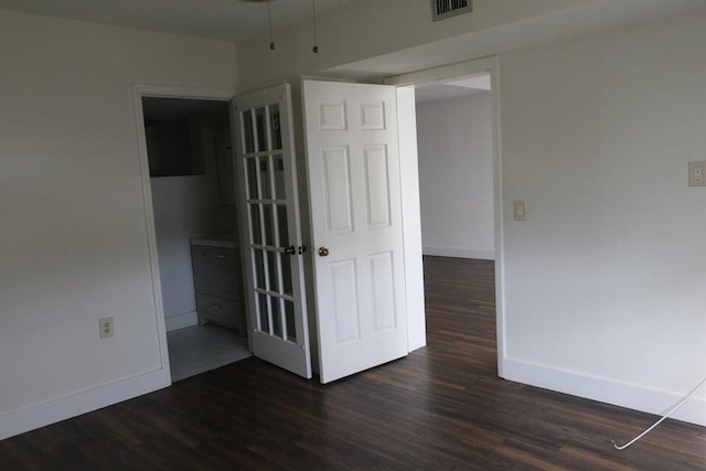3710 Whitehall Dr Unit 304, West Palm Beach, FL 33401 - unfurnished room featuring baseboards and dark wood-style floors