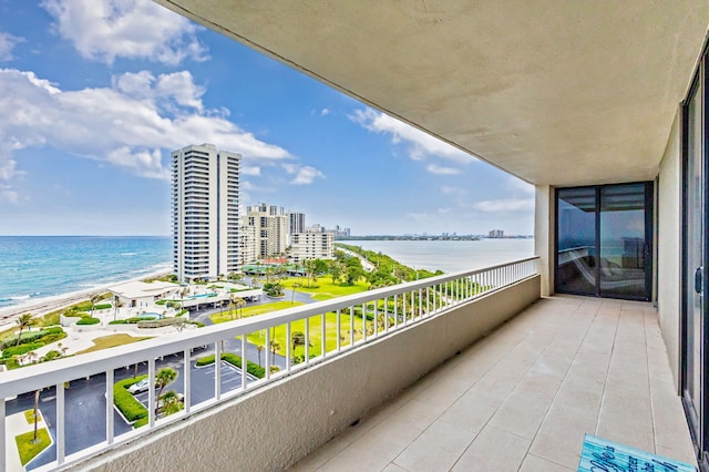 balcony with a water view and a city view