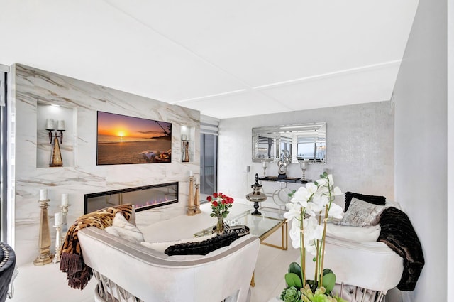 living area featuring a high end fireplace