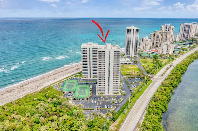 bird's eye view featuring a view of the beach and a water view