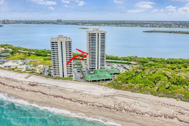 aerial view featuring a view of the beach and a water view