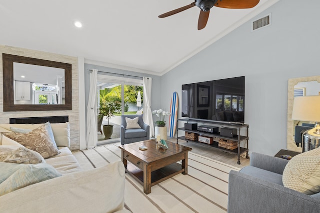 living area with lofted ceiling, a ceiling fan, light wood-type flooring, crown molding, and recessed lighting