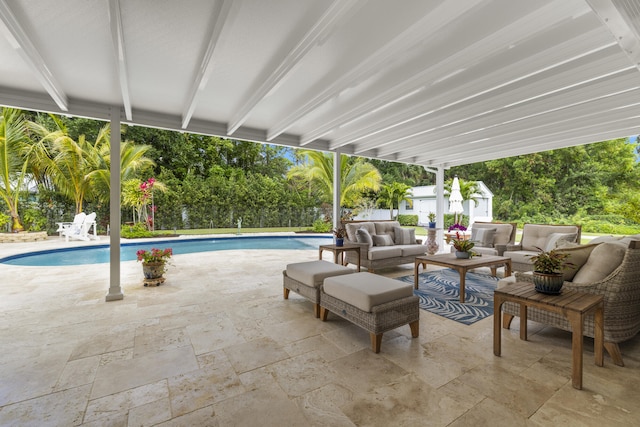 swimming pool featuring outdoor lounge area, a patio area, and a fenced backyard