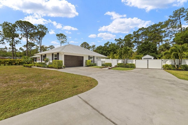 ranch-style home with a gate, driveway, metal roof, and an attached garage