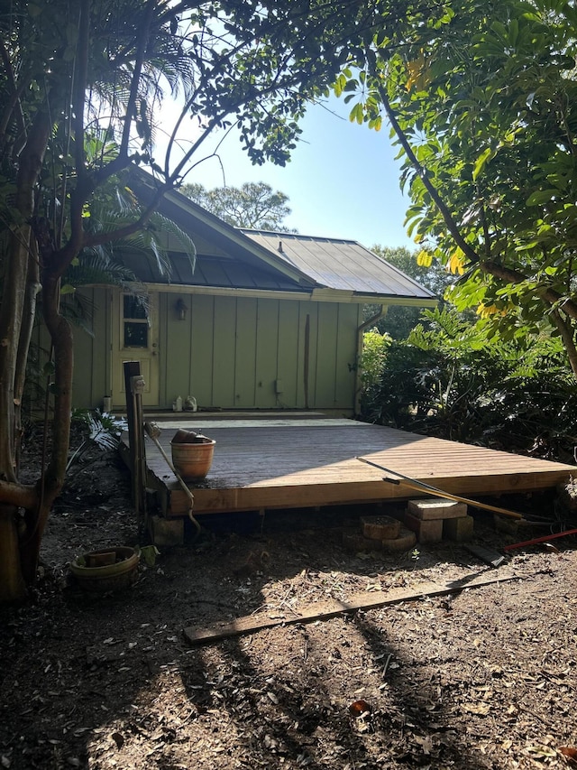 1614 SW Saint Andrews Dr, Palm City, FL 34990 - view of home's exterior with board and batten siding and a wooden deck