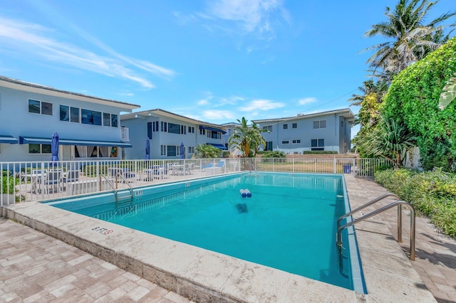 community pool featuring fence